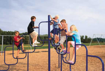 children climbing on a climber